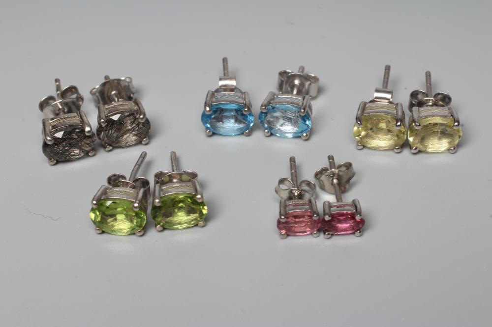 FIVE PAIRS OF GEM SET EAR STUDS including pink tourmaline, blue topaz and peridot, all set in silver Image