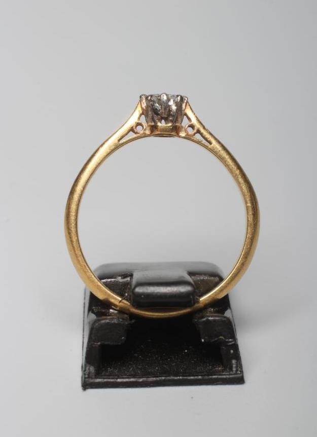 A SOLITAIRE DIAMOND RING, the brilliant cut stone of approximately 0.25cts, claw set to a plain Image
