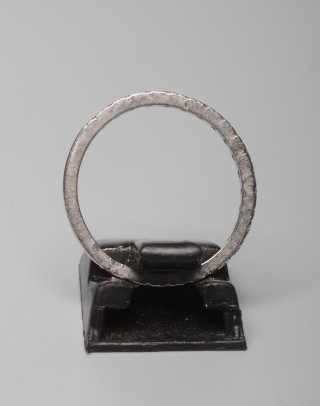 A DIAMOND HALF HOOP ETERNITY RING, the twenty two small round brilliants pave set to a plain white Image