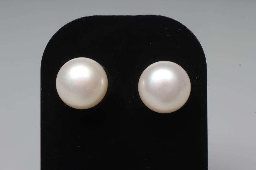 A PAIR OF CULTURED PEARL EAR STUDS, the peg set pearls on plain posts stamped 375 with butterflies Image