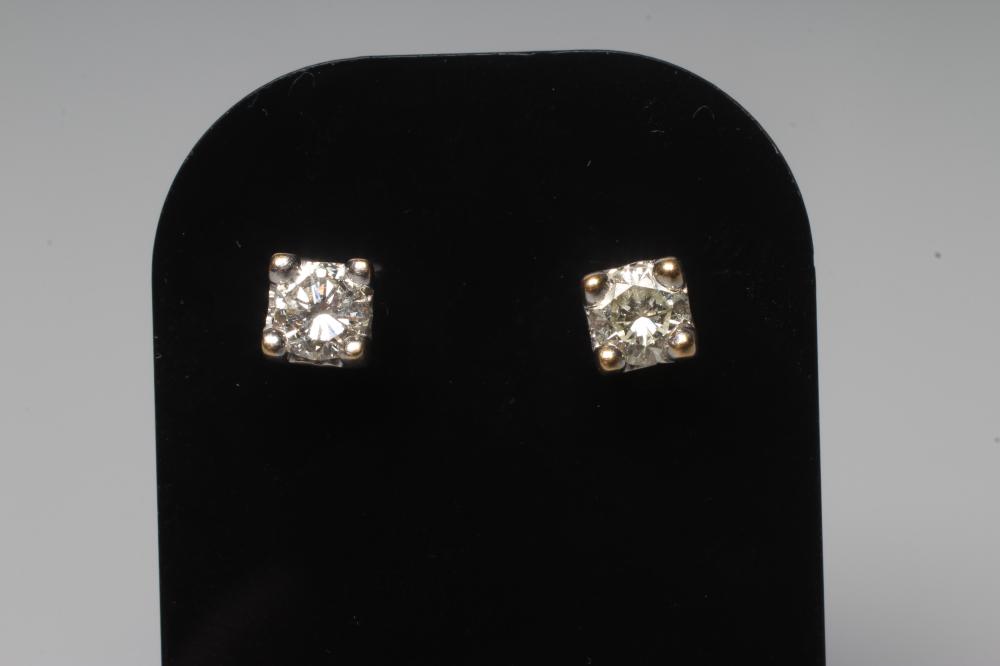 A PAIR OF DIAMOND SOLITAIRE EAR STUDS, each brilliant cut stone of 0.30ct, claw set to 18ct posts Image