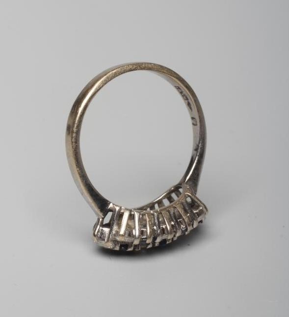 A SAPPHIRE AND DIAMOND DRESS RING, with eight each stones in diagonal settings to a plain 18ct white Image