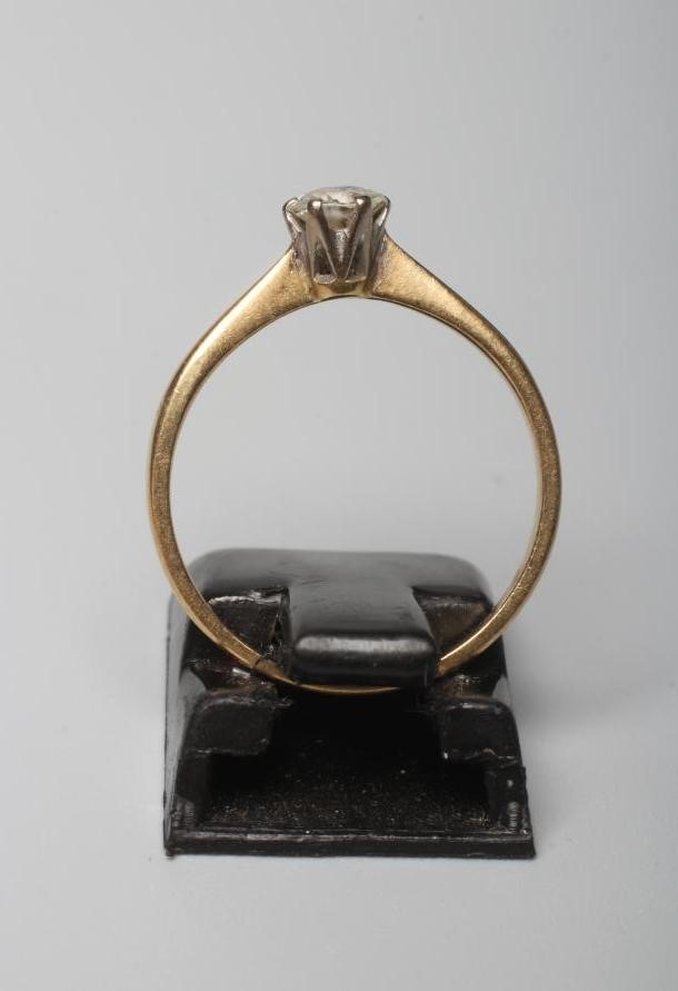 A DIAMOND SOLITAIRE RING, the brilliant cut stone of approximately 0.35cts, claw set to a plain Image