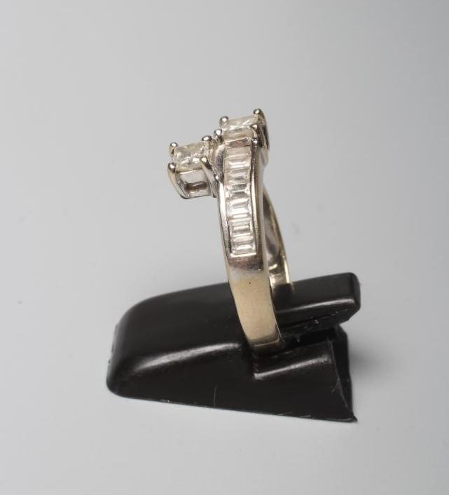 A DIAMOND HALF HOOP RING Image
