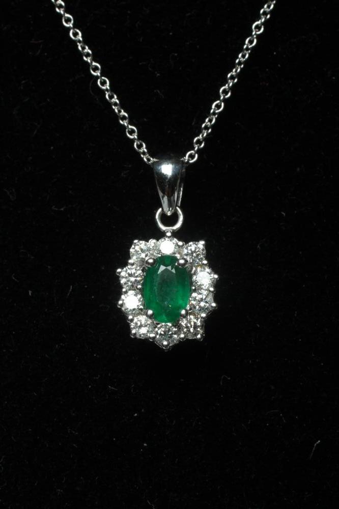 AN EMERALD AND DIAMOND PENDANT Image