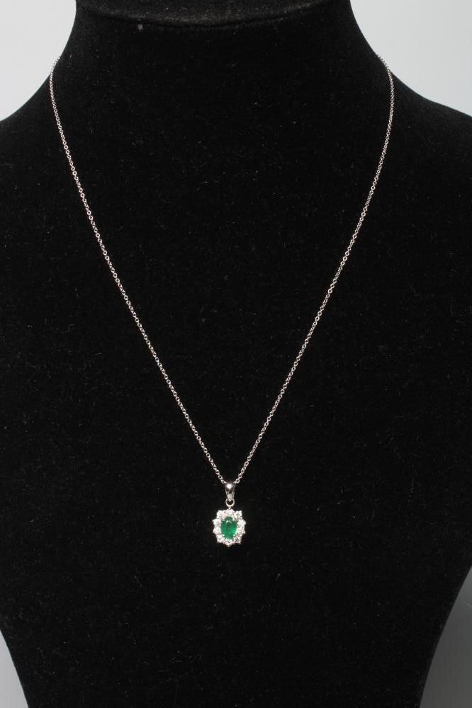 AN EMERALD AND DIAMOND PENDANT Image