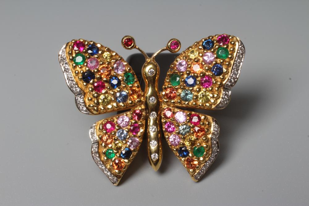 A MULTI-GEM BUTTERFLY BROOCH with ruby set antennae, diamond body and coloured gem wings, stamped Image