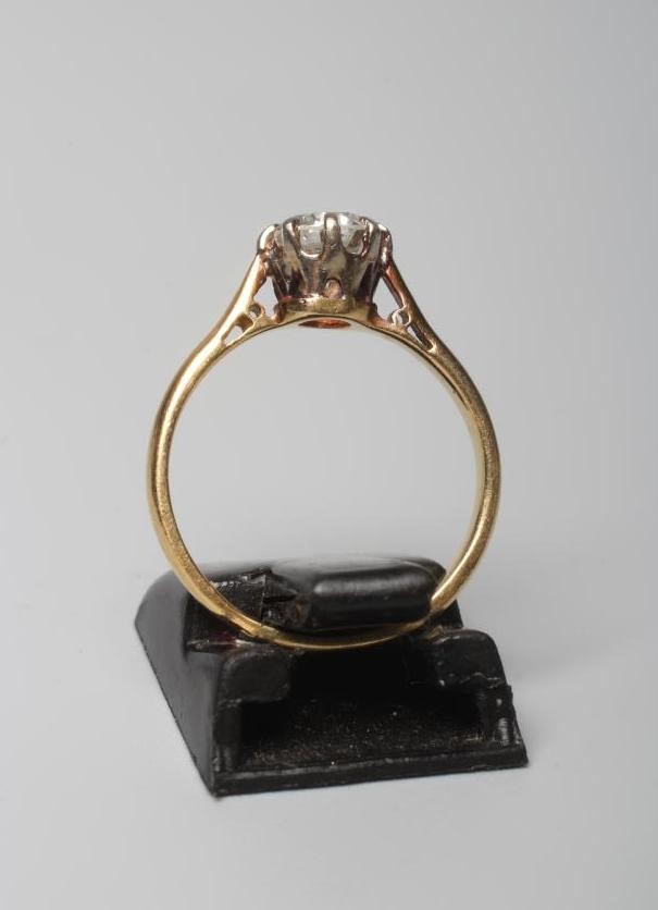 A SOLITAIRE DIAMOND RING, the brilliant cut stone of approximately 0.70cts, claw set to a plain Image