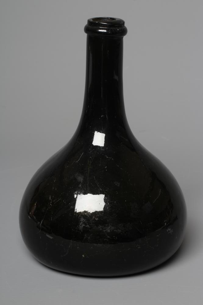 A GREEN ONION GLASS BOTTLE, mid 18th century, of typical form with single ring neck, plain deep kick Image