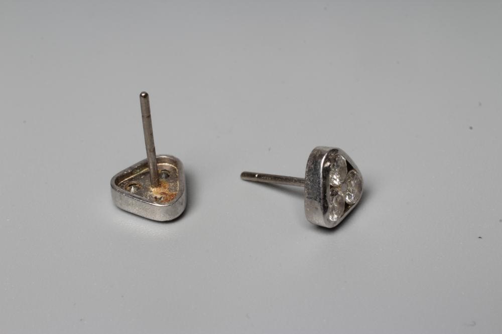 A PAIR OF DIAMOND EAR STUDS, the triangular panels each set with three brilliant cut stones to Image