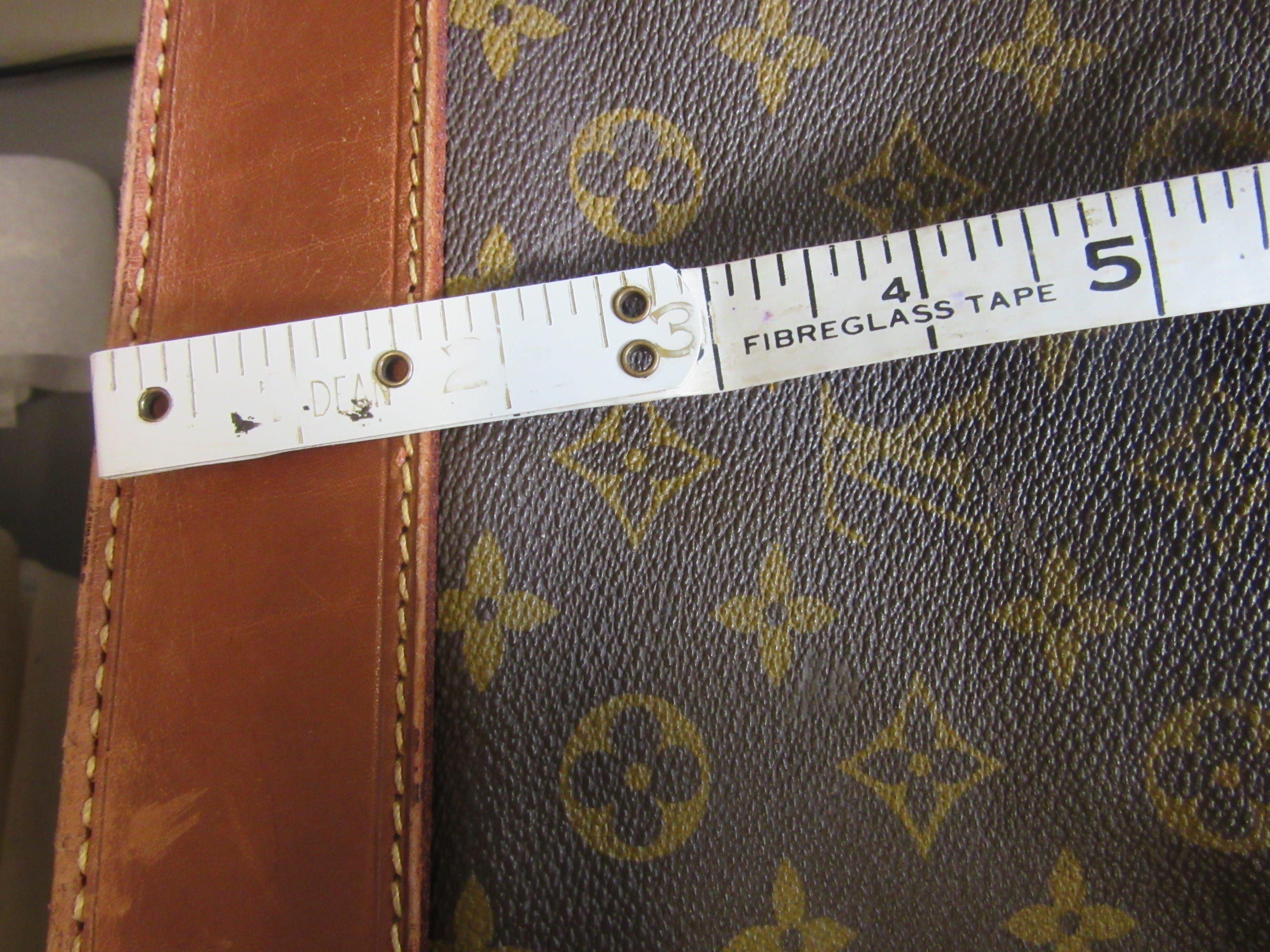 A VINTAGE LOUIS VUITTON STEAMER BAG "45" in monogram canvas and natural tan leather, embossed serial Image