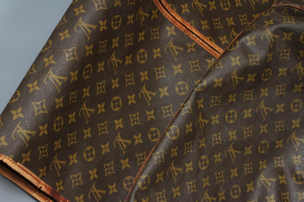 A VINTAGE LOUIS VUITTON STEAMER BAG "65" in monogram canvas and natural tan leather, base 10 1/4" x Image