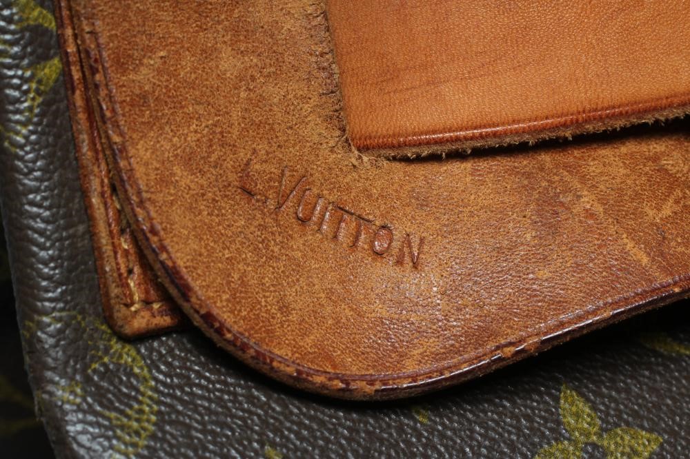 A VINTAGE LOUIS VUITTON STEAMER BAG "35" in monogram canvas and natural tan leather, embossed serial Image
