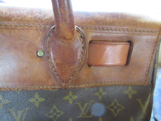 A VINTAGE LOUIS VUITTON STEAMER BAG "35" in monogram canvas and natural tan leather, embossed serial Image