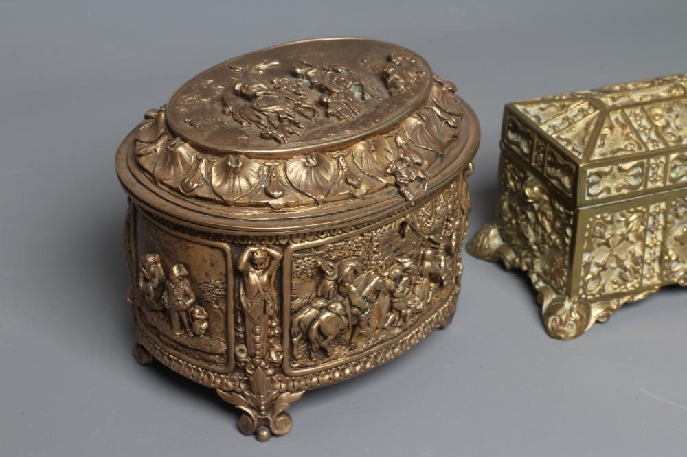 AN EARLY 20TH CENTURY FRENCH ORMOLU OVAL MUSICAL JEWELLERY CASKET with hinged top and medieval Image