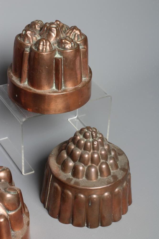 EIGHT VICTORIAN COPPER JELLY MOULDS comprising six circular examples Image