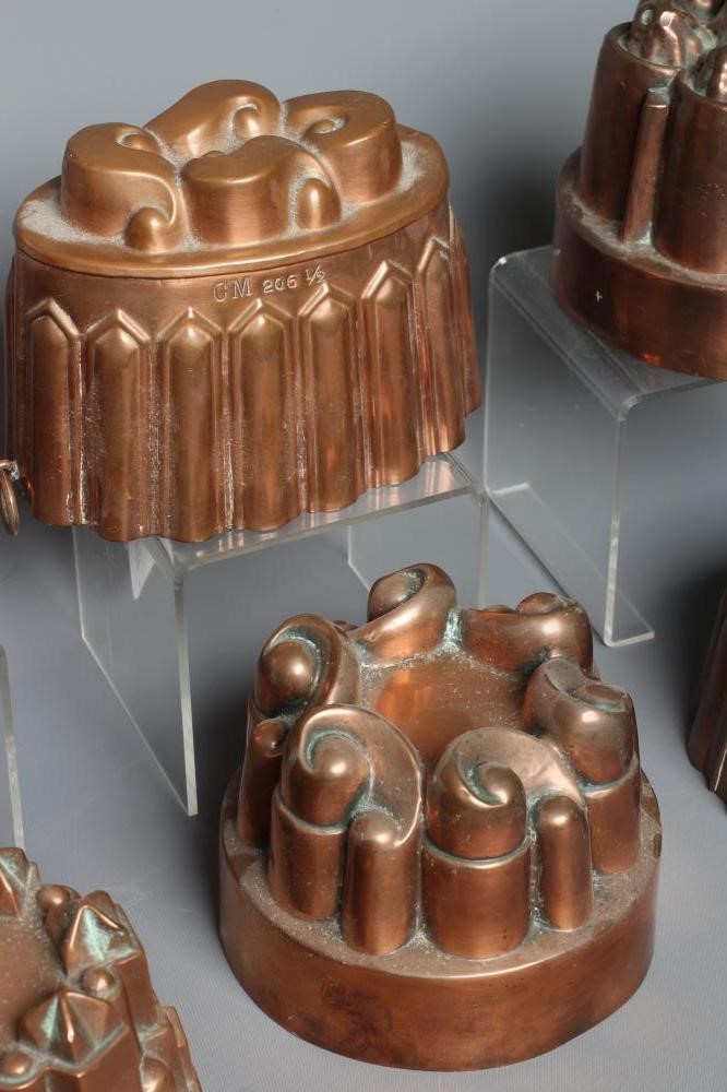 EIGHT VICTORIAN COPPER JELLY MOULDS comprising six circular examples Image