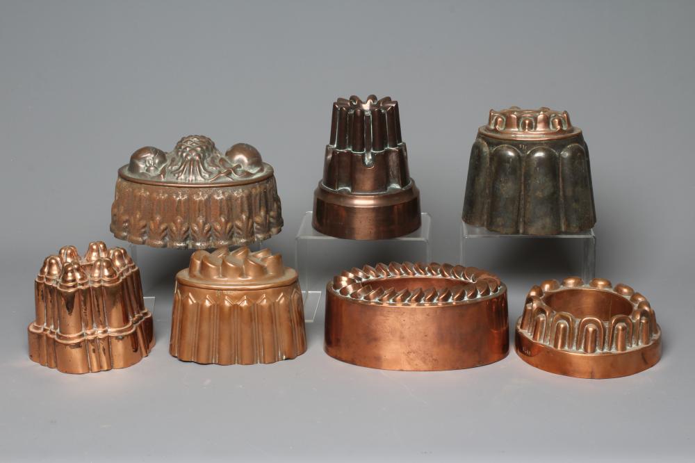 SEVEN VICTORIAN COPPER JELLY MOULDS comprising of five oval examples Image