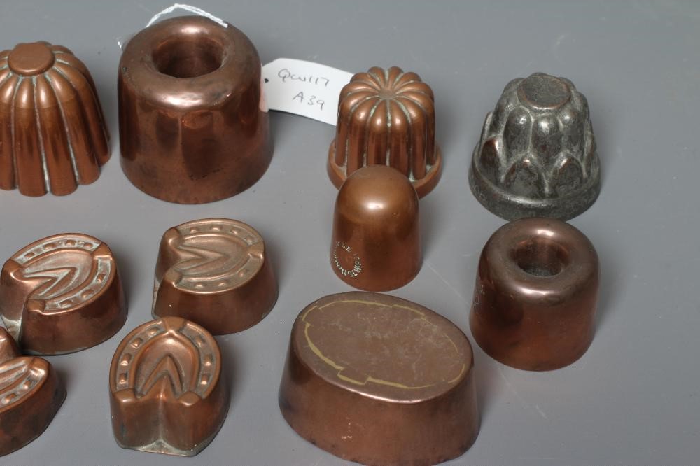 SIXTEEN MINIATURE VICTORIAN COPPER JELLY AND FOOD MOULDS, with shapes including horseshoes, turrets, Image