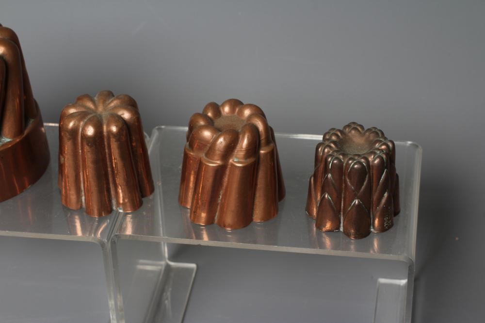 TWENTY MINIATURE VICTORIAN JELLY AND FOOD MOULDS, with shapes including angled and straight turrets, Image