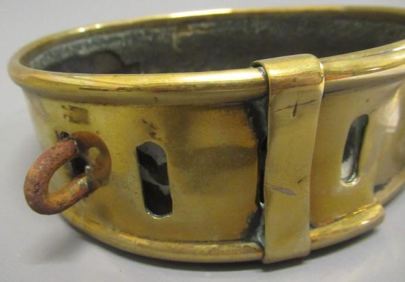 A LARGE 19TH CENTURY BRASS DOG COLLAR, un-named, plain circular with swivel loop and Victorian brass Image