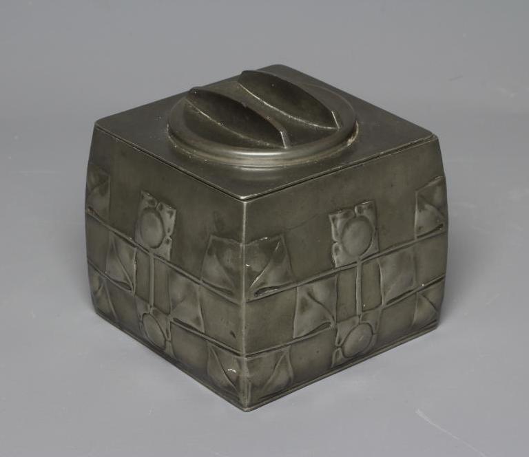 ARCHIBALD KNOX (1864-1933) A PEWTER BISCUIT BARREL, c.1900, stamped 'TUDRIC, 0194' and embossed with Image