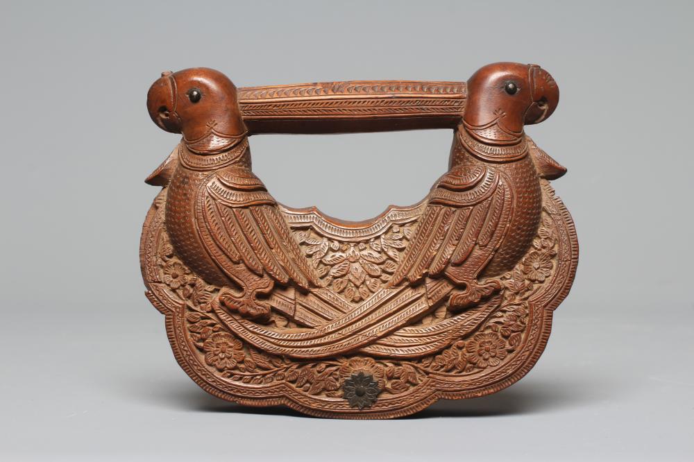 A 19TH CENTURY MYSORE CARVED SANDALWOOD FAN HANDLE with two parrots carved to each side and each Image