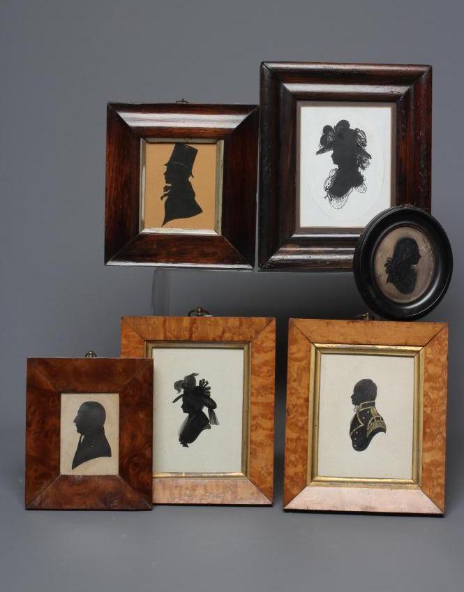 A PAIR OF EARLY 20TH CENTURY SILHOUETTES OF A LADY AND A GENTLEMAN in period Georgian costume Image