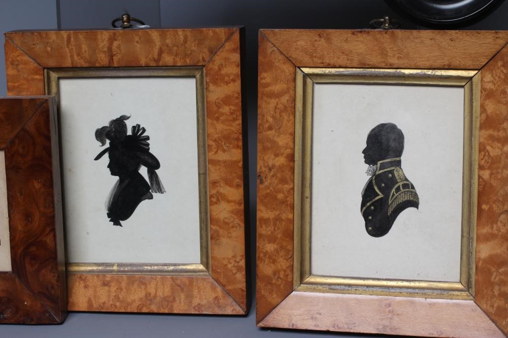 A PAIR OF EARLY 20TH CENTURY SILHOUETTES OF A LADY AND A GENTLEMAN in period Georgian costume Image