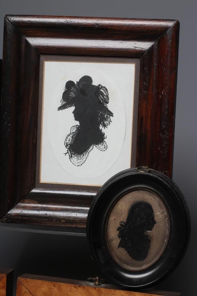 A PAIR OF EARLY 20TH CENTURY SILHOUETTES OF A LADY AND A GENTLEMAN in period Georgian costume Image