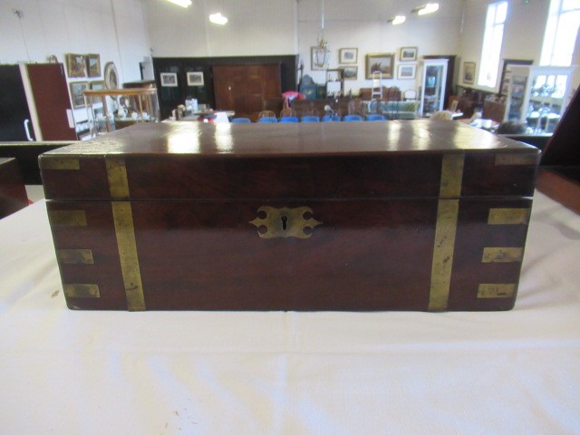 A 19TH CENTURY MAHOGANY BRASS BOUND CAMPAIGN WRITING SLOPE Image