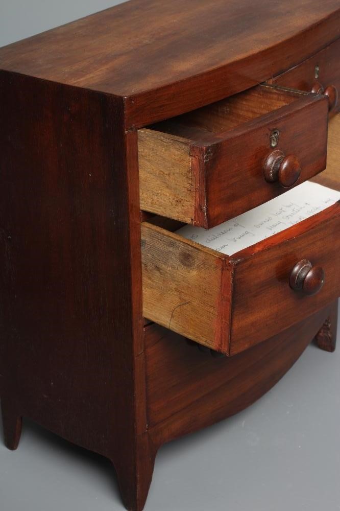 A 19TH CENTURY MINIATURE MAHOGANY BOW FRONT CHEST OF DRAWERS, the oblong top above two short and Image