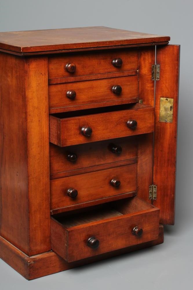A 19TH CENTURY MAHOGANY TABLE TOP WELLINGTON CHEST, the oblong top over six long graduating drawers Image
