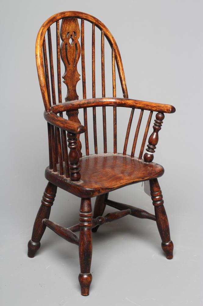 A MINIATURE ASH WINDSOR ARMCHAIR of high hoop spindle back form with carved central splat and ring Image