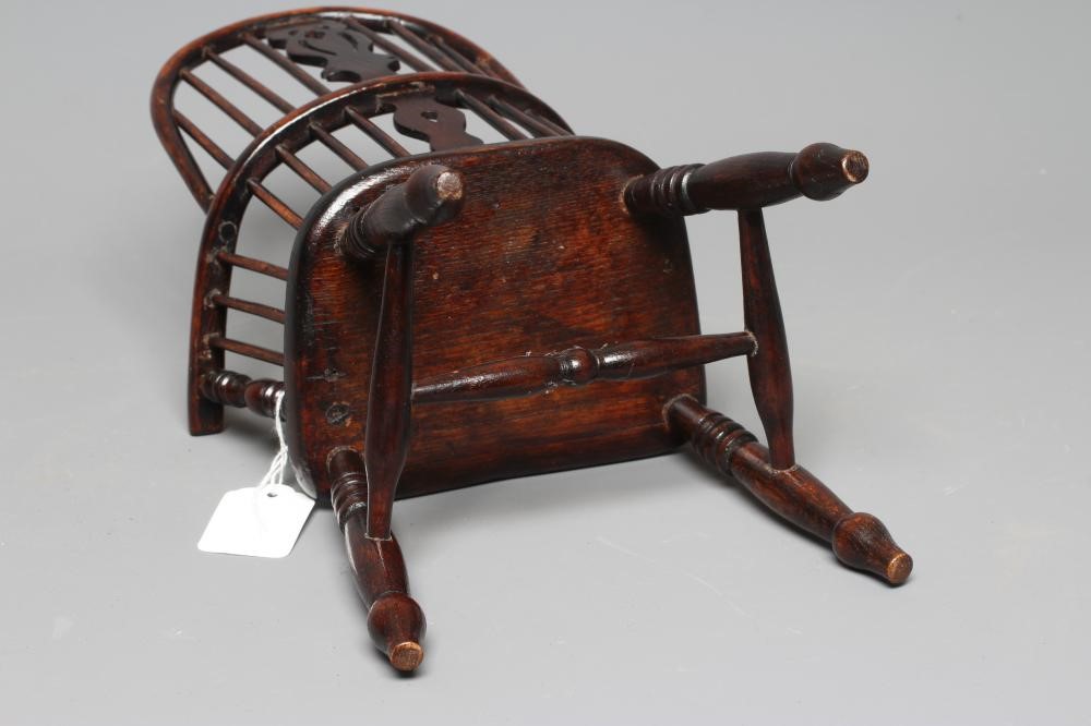 A MINIATURE ASH WINDSOR ARMCHAIR of high hoop spindle back form with carved central splat and ring Image