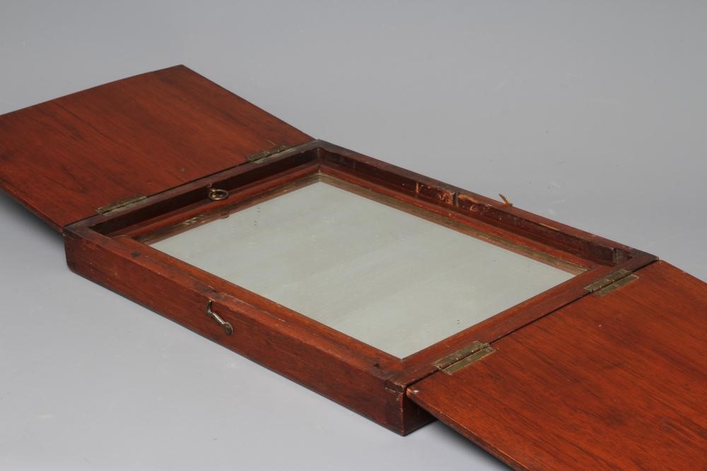 A 19TH CENTURY FOLDING CAMPAIGN TOILET MIRROR, the oblong plate in a moulded frame folding into a Image