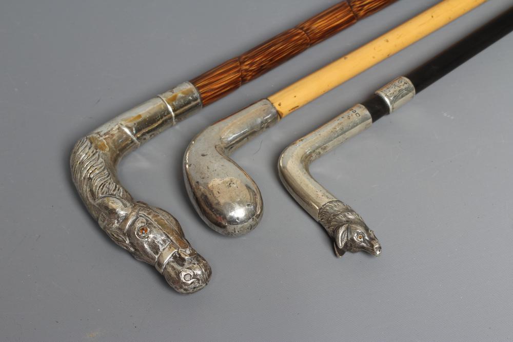 AN EARLY 20TH CENTURY SILVER PISTOL GRIP CANE Image