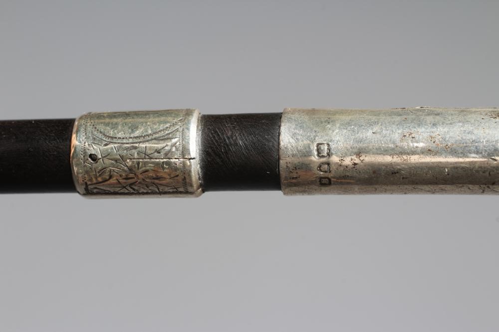 AN EARLY 20TH CENTURY SILVER PISTOL GRIP CANE Image