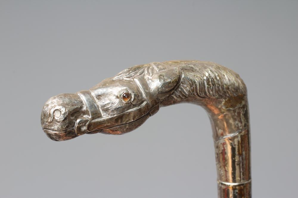 AN EARLY 20TH CENTURY SILVER PISTOL GRIP CANE Image