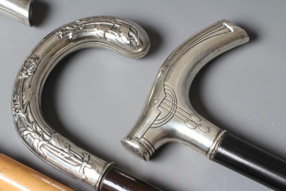 A GERMAN SILVER CRUTCH HANDLE WALKING STICK with Art Nouveau style embossed decoration Image