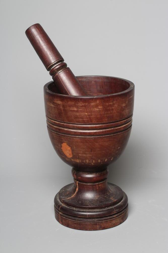 A 19TH CENTURY LIGNUM VITAE PESTLE AND MORTAR Image