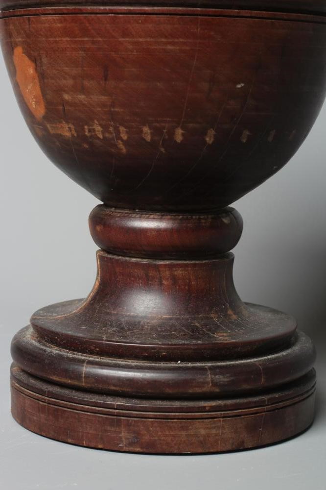 A 19TH CENTURY LIGNUM VITAE PESTLE AND MORTAR Image