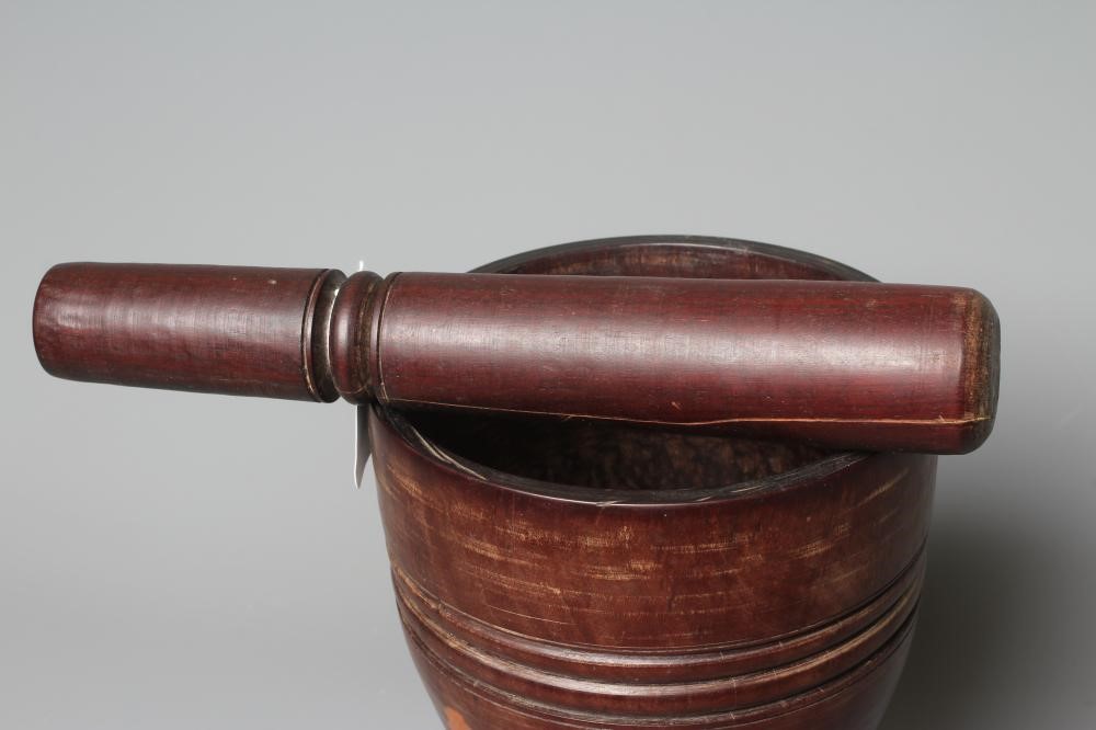A 19TH CENTURY LIGNUM VITAE PESTLE AND MORTAR Image