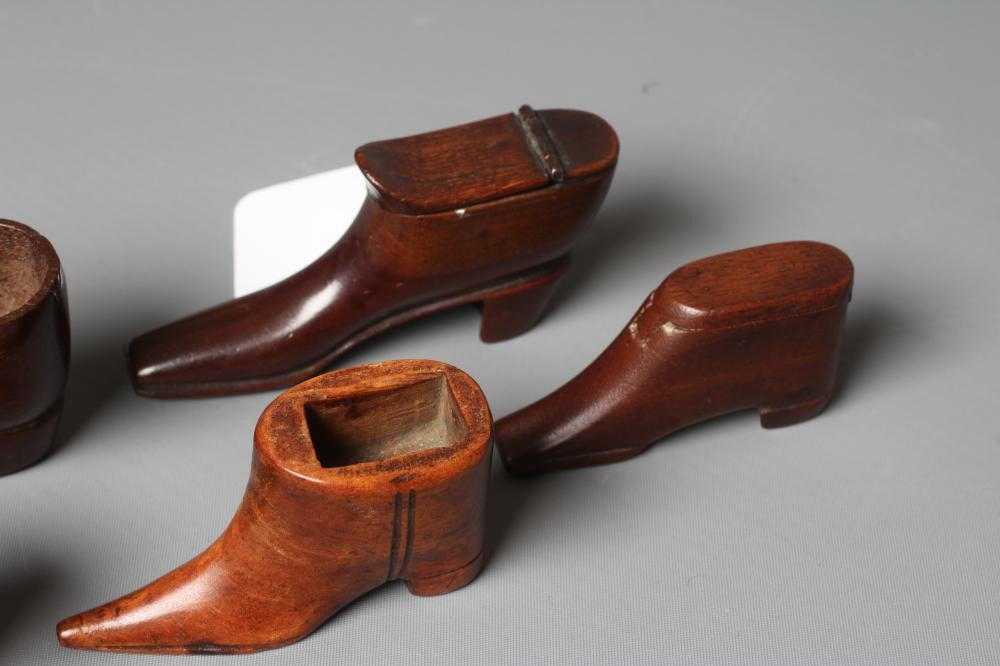 A 19TH CENTURY MAHOGANY SHOE SNUFF BOX with a hinged cover, 3 1/4" long, together with another treen Image