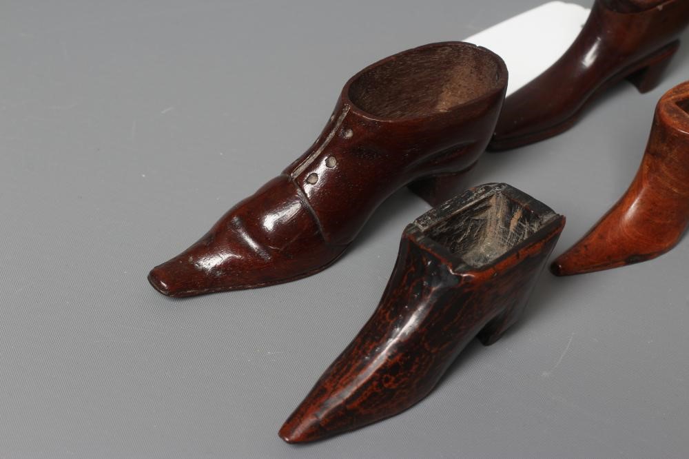 A 19TH CENTURY MAHOGANY SHOE SNUFF BOX with a hinged cover, 3 1/4" long, together with another treen Image