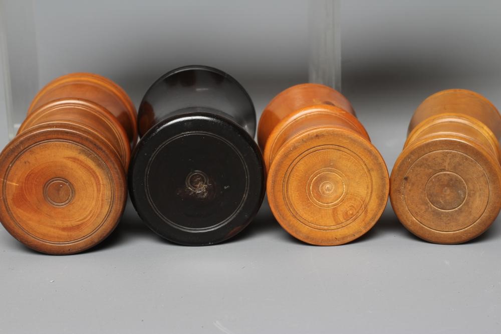 NINE 19TH CENTURY TREEN AND LIGNUM VITAE DICE SHAKERS of waisted form with exterior mouldings and Image