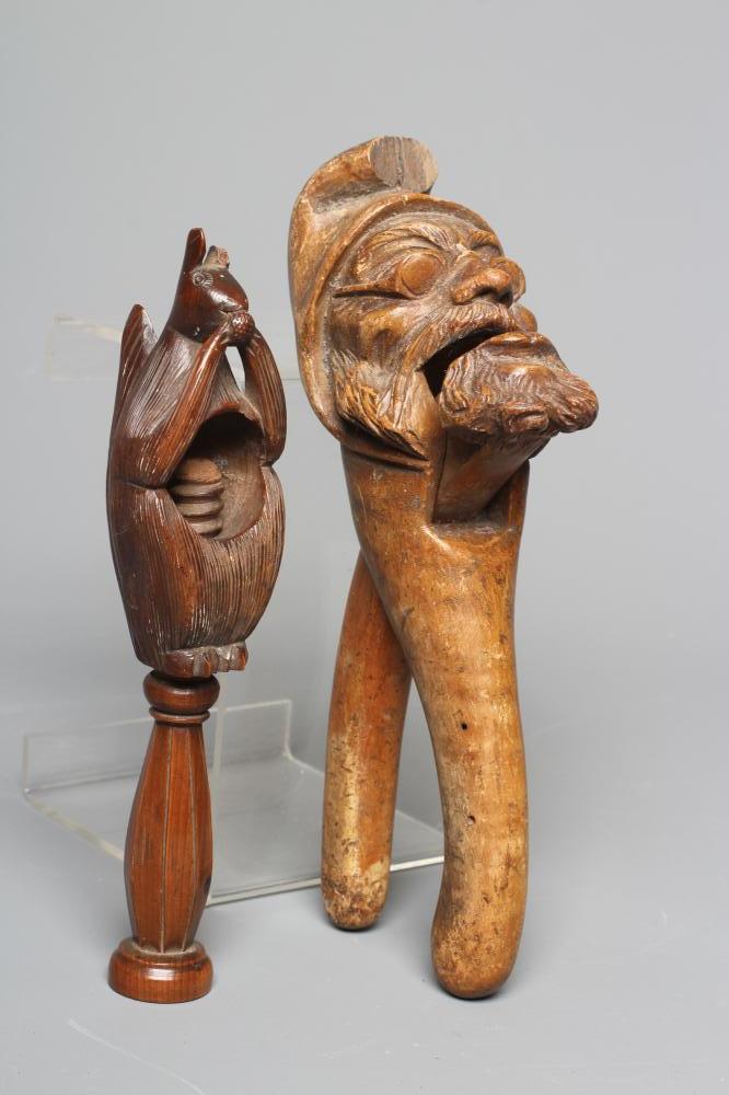 A 19TH CENTURY TREEN SCREW TYPE NUTCRACKER carved as a squirrel eating a nut Image