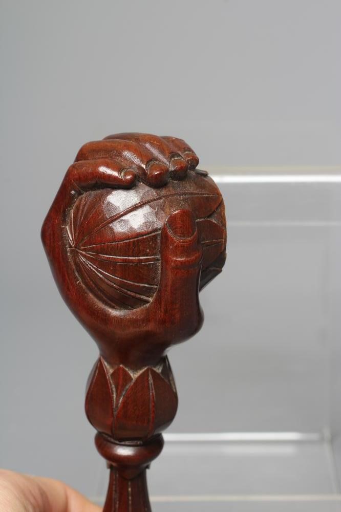 A 19TH CENTURY WALNUT SCREW TYPE NUTCRACKER Image