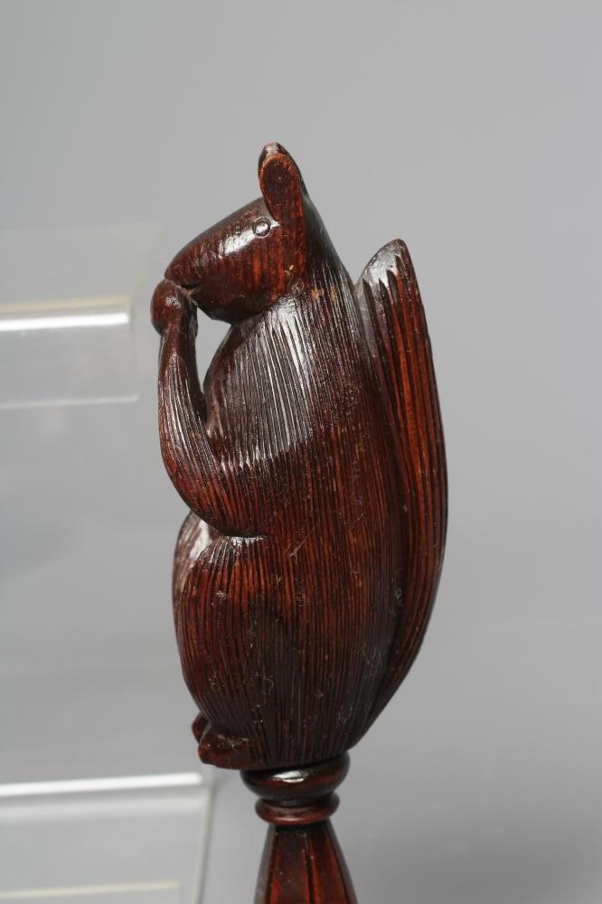 A 19TH CENTURY WALNUT SCREW TYPE NUTCRACKER Image