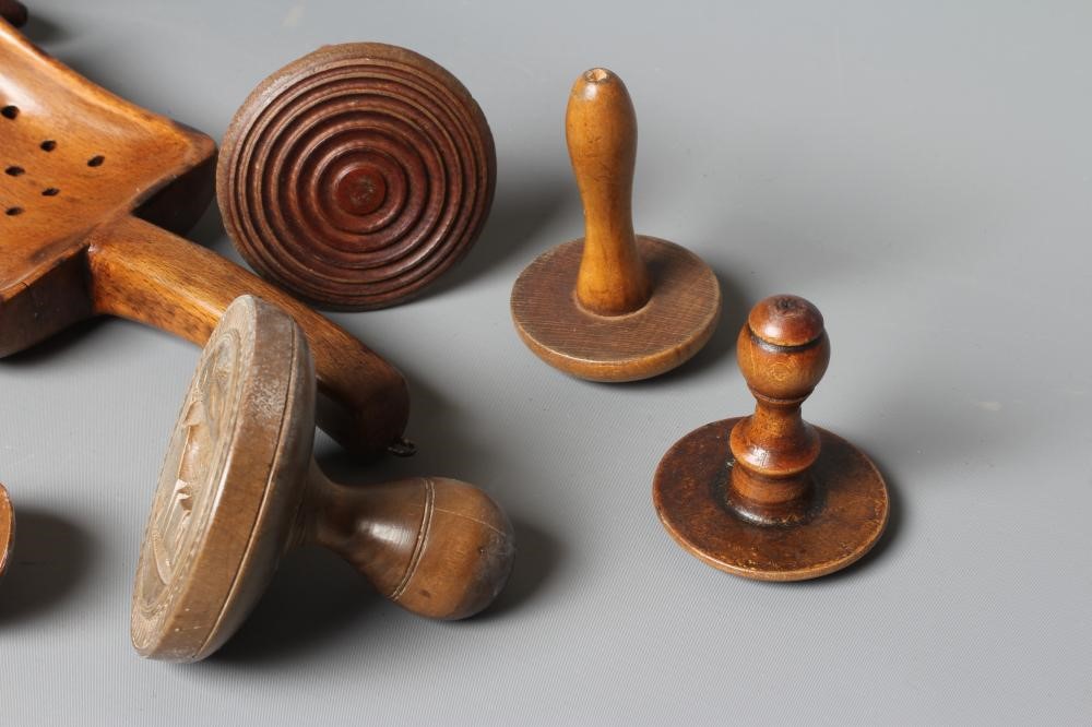 A COLLECTION OF 19TH CENTURY TREEN KITCHENALIA, comprising of a butter spoon, lemon squeezer, butter Image